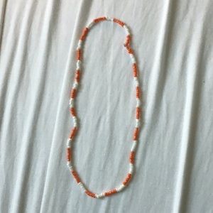 Orange and white beaded necklace